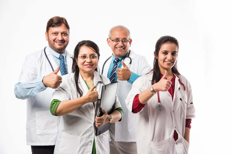 Indian/asian doctors group photo showing success/thumbs up sign